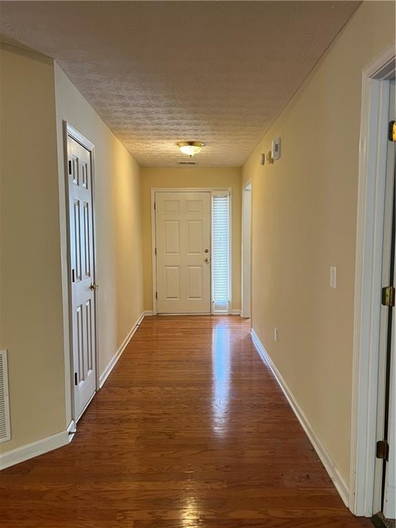 964 Village View Cir, Loganville, GA 30052 - foyer entrance featuring wood finished floors, baseboards, and a textured ceiling