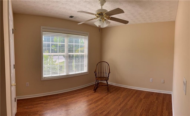 964 Village View Cir, Loganville, GA 30052 - unfurnished room with wood finished floors, baseboards, ceiling fan, and a textured ceiling