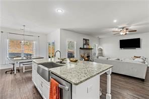 6547 River Station Dr, Lula, GA 30554 - kitchen with a sink, dark wood-style flooring, a ceiling fan, open floor plan, and a kitchen breakfast bar