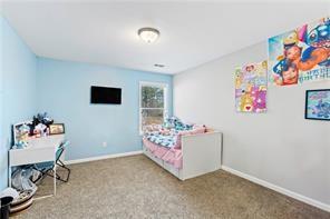 6547 River Station Dr, Lula, GA 30554 - carpeted bedroom featuring baseboards
