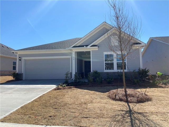 view of front of home with a garage and concrete driveway