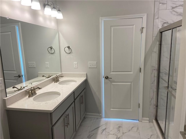 full bathroom featuring double vanity, marble finish floor, and a sink