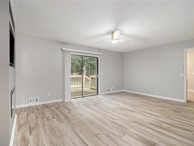 2544 Peyton Woods Trl SW, Atlanta, GA 30311 - unfurnished living room with ceiling fan, light wood-type flooring, baseboards, and a textured ceiling