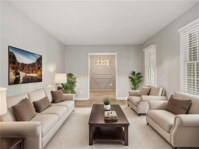 2544 Peyton Woods Trl SW, Atlanta, GA 30311 - living area with a chandelier, light wood-style floors, and baseboards
