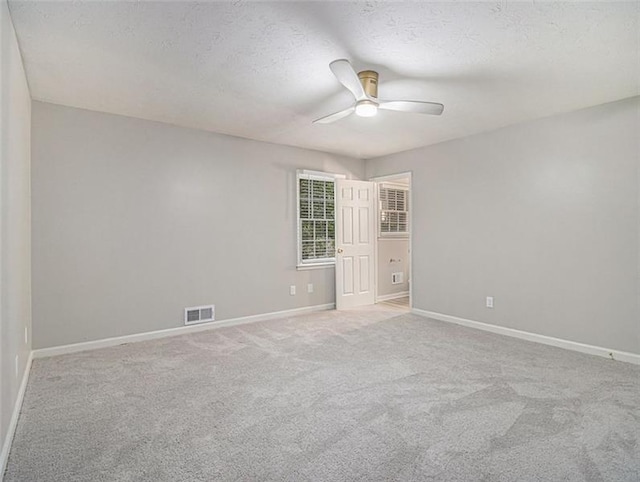 2544 Peyton Woods Trl SW, Atlanta, GA 30311 - carpeted spare room featuring a ceiling fan, baseboards, and a textured ceiling