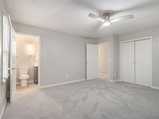2544 Peyton Woods Trl SW, Atlanta, GA 30311 - unfurnished bedroom featuring carpet floors, ensuite bathroom, baseboards, a closet, and a ceiling fan