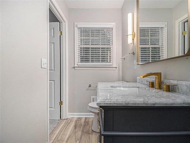 2544 Peyton Woods Trl SW, Atlanta, GA 30311 - bathroom with baseboards, wood finished floors, vanity, and toilet