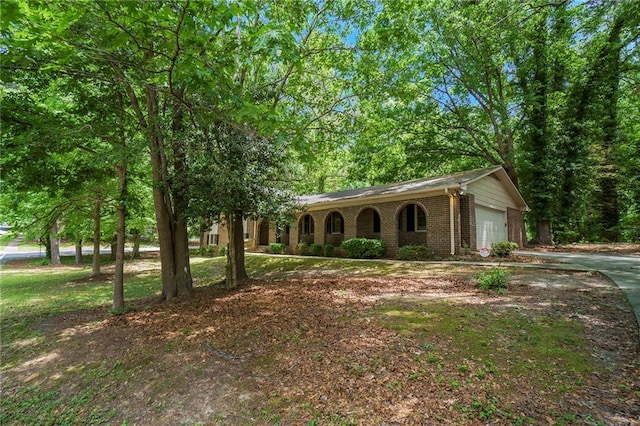 2544 Peyton Woods Trl SW, Atlanta, GA 30311 - view of front facade with brick siding, a garage, and concrete driveway