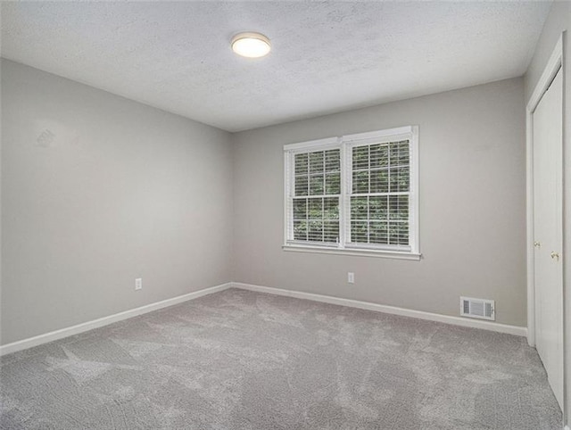 2544 Peyton Woods Trl SW, Atlanta, GA 30311 - empty room with carpet floors, baseboards, and a textured ceiling