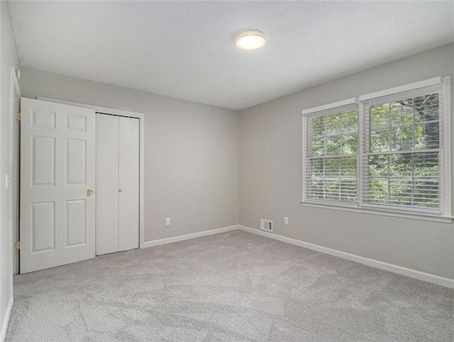2544 Peyton Woods Trl SW, Atlanta, GA 30311 - unfurnished bedroom featuring baseboards, carpet flooring, and a closet