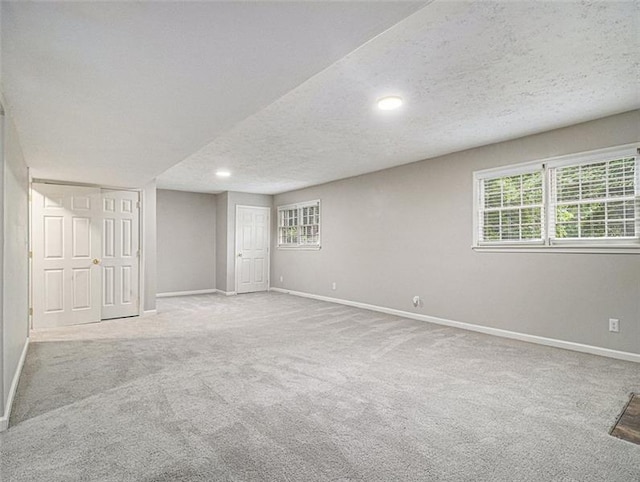 2544 Peyton Woods Trl SW, Atlanta, GA 30311 - basement featuring a textured ceiling, baseboards, carpet flooring, and recessed lighting