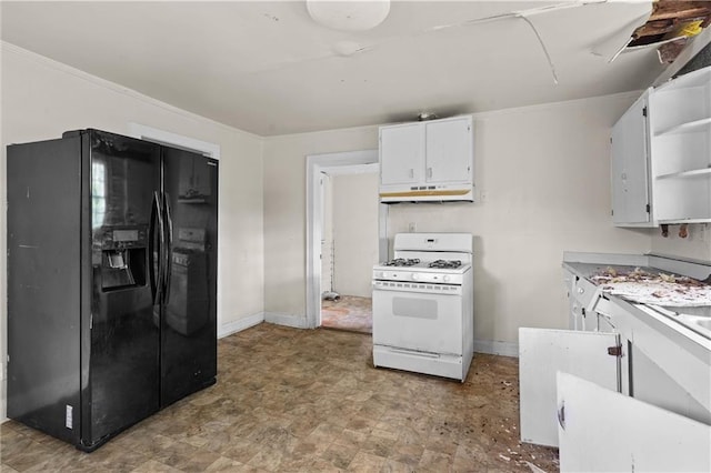 kitchen featuring open shelves, black fridge, white cabinetry, white range with gas stovetop, and under cabinet range hood