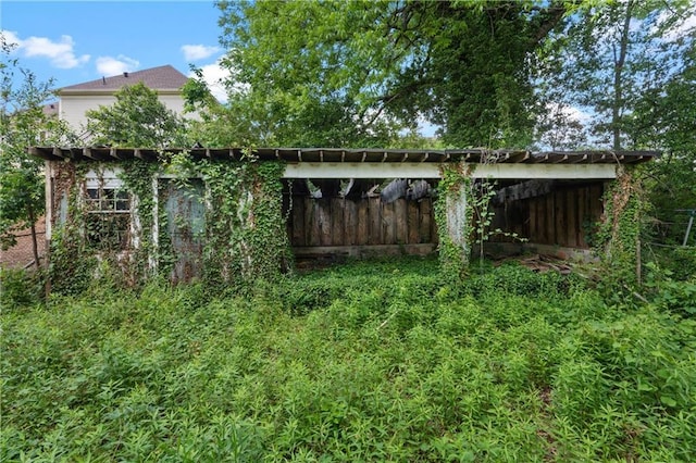view of outbuilding featuring a carport