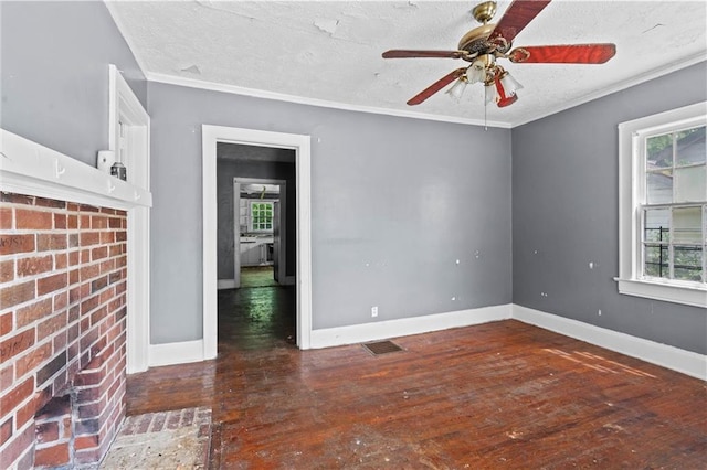 unfurnished room featuring ceiling fan, visible vents, baseboards, and hardwood / wood-style flooring