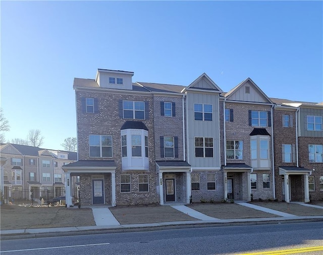 545 Fundao Ln # 25, Lawrenceville, GA 30046 - townhome / multi-family property with board and batten siding and brick siding