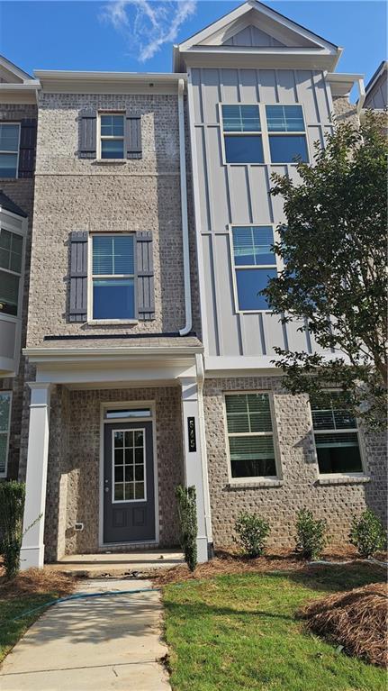 545 Fundao Ln # 25, Lawrenceville, GA 30046 - townhome / multi-family property with board and batten siding and brick siding