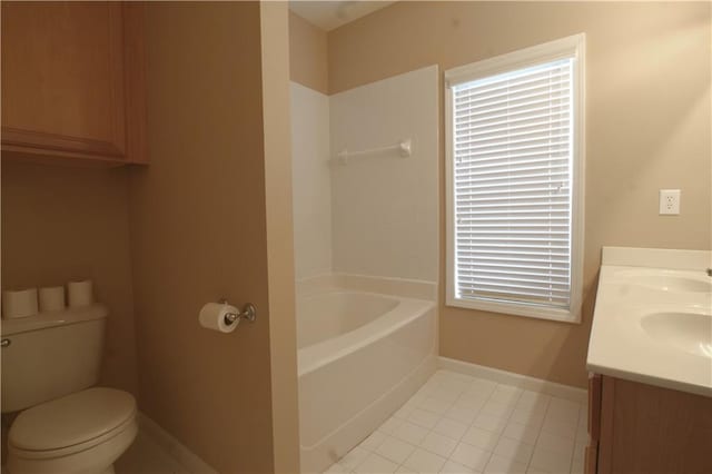 bathroom with a tub to relax in, vanity, tile patterned floors, and toilet