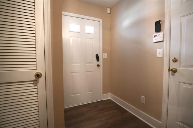 doorway featuring dark wood-type flooring