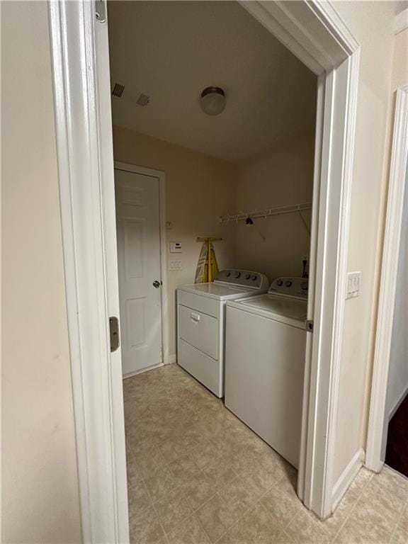 laundry room featuring independent washer and dryer