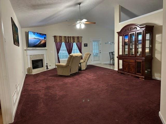 living room featuring high vaulted ceiling, carpet flooring, and ceiling fan