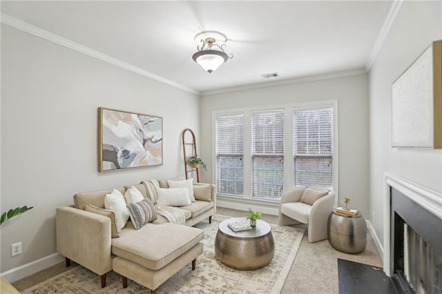 living area with visible vents, a fireplace with flush hearth, carpet, and crown molding