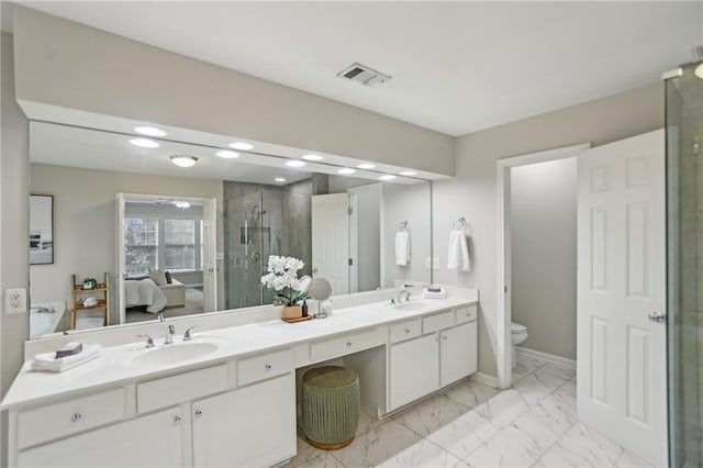 ensuite bathroom with visible vents, ensuite bath, a stall shower, a sink, and marble finish floor