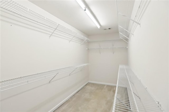 spacious closet featuring visible vents