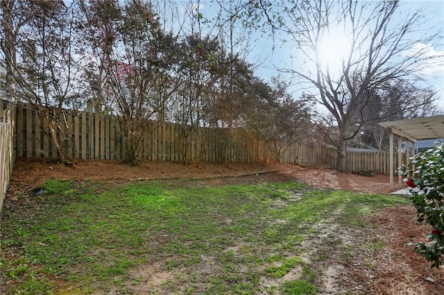 view of yard with a fenced backyard