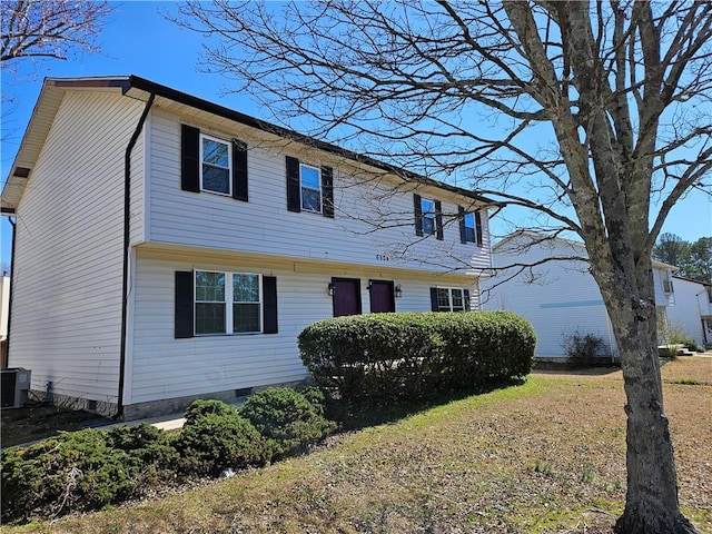 colonial inspired home with crawl space and central AC unit