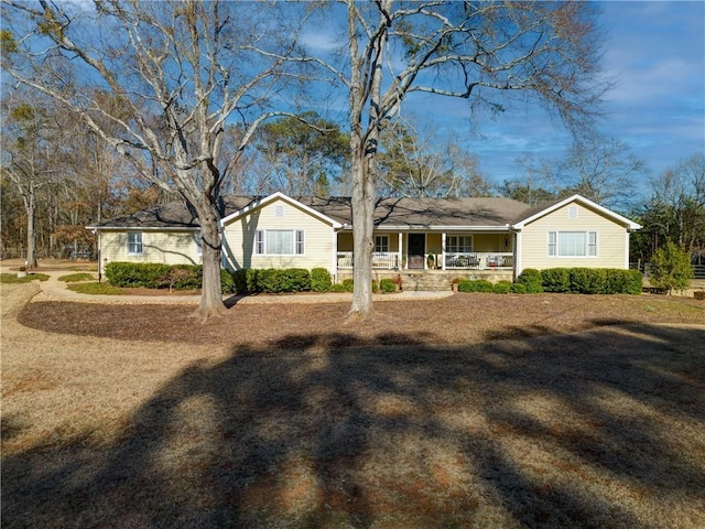 ranch-style home featuring covered porch