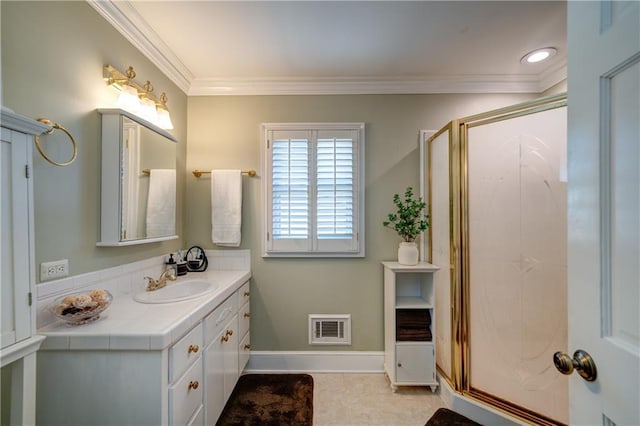 bathroom with vanity, an enclosed shower, and crown molding