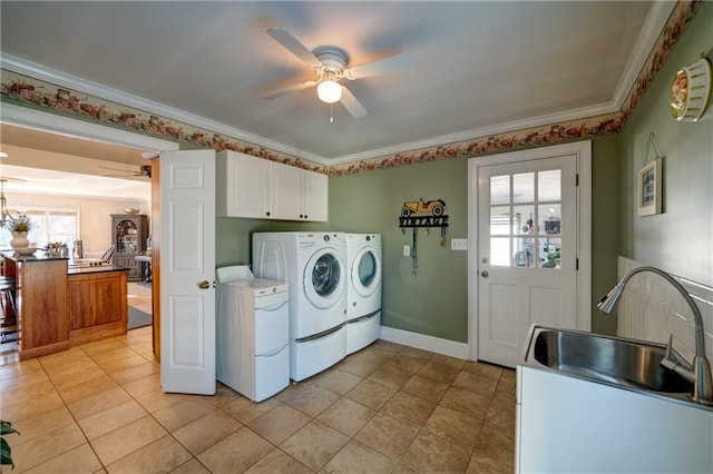 laundry room featuring cabinets, ceiling fan, a healthy amount of sunlight, and washer and clothes dryer