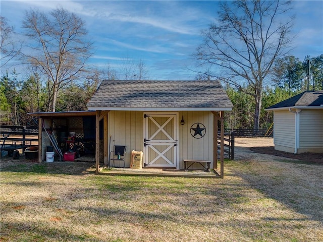 view of outbuilding featuring a yard