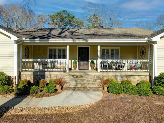 view of front of property featuring covered porch