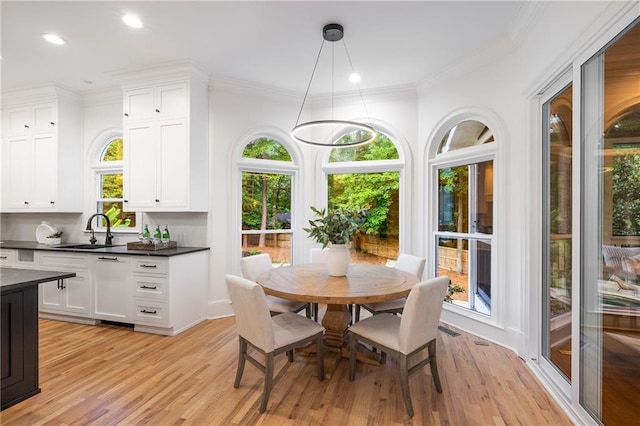 510 Northland Ridge Ct, Sandy Springs, GA 30342 - dining space with light wood-style floors, recessed lighting, and crown molding