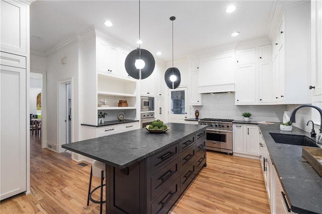 510 Northland Ridge Ct, Sandy Springs, GA 30342 - kitchen with appliances with stainless steel finishes, a center island, white cabinetry, open shelves, and light wood-type flooring