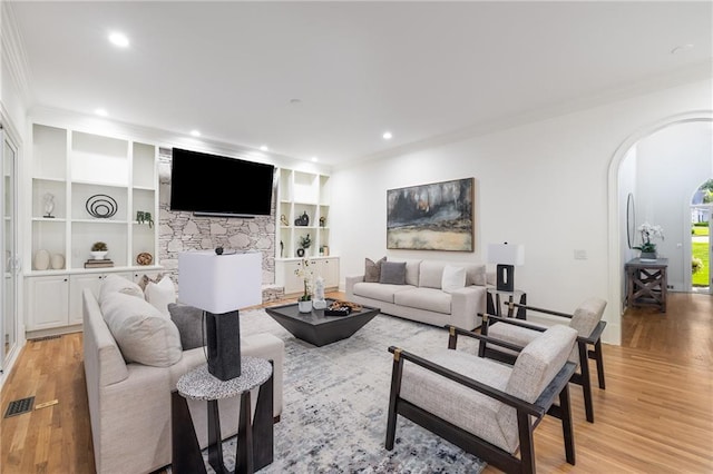510 Northland Ridge Ct, Sandy Springs, GA 30342 - living room featuring crown molding, light wood-style floors, arched walkways, built in features, and recessed lighting