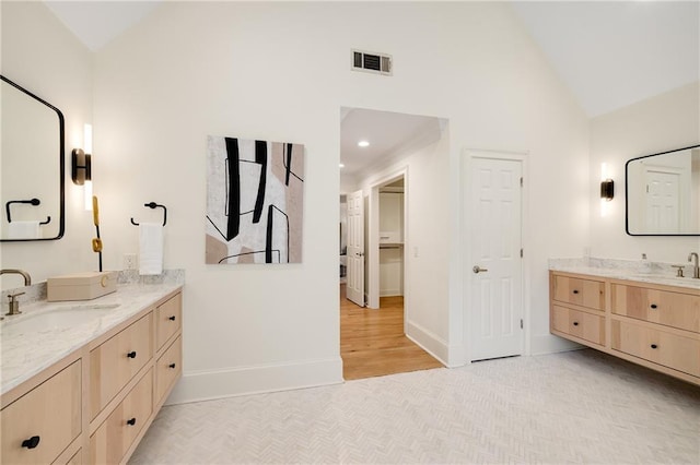 510 Northland Ridge Ct, Sandy Springs, GA 30342 - full bathroom featuring two vanities, high vaulted ceiling, and wood finished floors