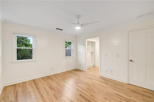 510 Northland Ridge Ct, Sandy Springs, GA 30342 - unfurnished bedroom with multiple windows, light wood-style flooring, crown molding, and ceiling fan