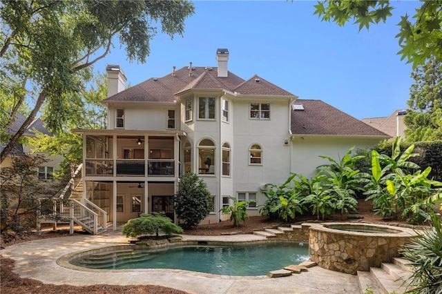 510 Northland Ridge Ct, Sandy Springs, GA 30342 - back of property featuring a sunroom, stairs, an in-ground hot tub, ceiling fan, and stucco siding