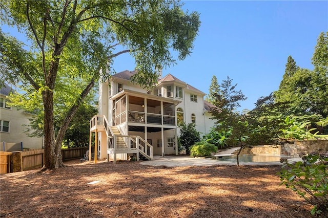 510 Northland Ridge Ct, Sandy Springs, GA 30342 - rear view of house with a sunroom, stairway, a patio, a pool, and stucco siding