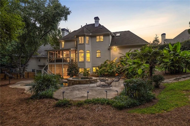 510 Northland Ridge Ct, Sandy Springs, GA 30342 - rear view of house featuring a patio area, an in-ground hot tub, a chimney, stucco siding, and stairs
