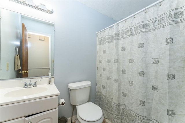 full bathroom with vanity, a shower with shower curtain, and toilet