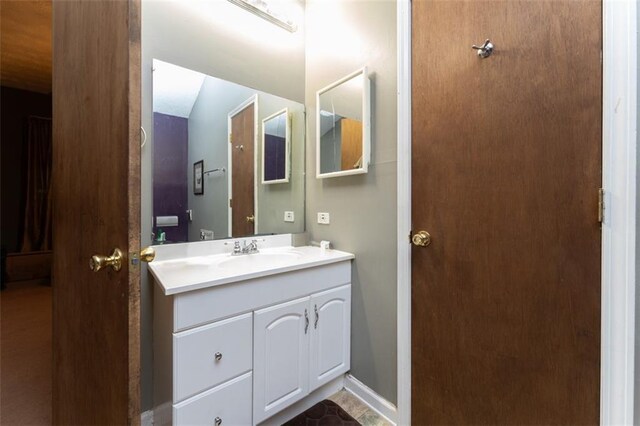 bathroom with tile patterned flooring and vanity