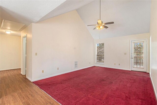 spare room with high vaulted ceiling, a ceiling fan, visible vents, and baseboards
