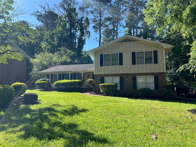 split level home featuring a front lawn