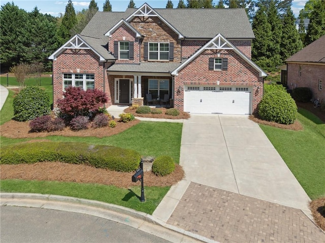 4650 Brighton View Trl, Cumming, GA 30040 - craftsman inspired home with concrete driveway, roof with shingles, a front lawn, brick siding, and a garage