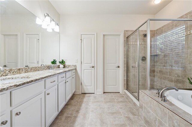 4650 Brighton View Trl, Cumming, GA 30040 - bathroom with double vanity, a bath, a sink, and a stall shower