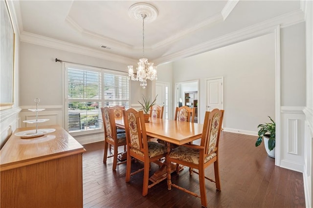 4650 Brighton View Trl, Cumming, GA 30040 - dining room with a tray ceiling, an inviting chandelier, dark wood finished floors, and ornamental molding