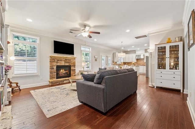 4650 Brighton View Trl, Cumming, GA 30040 - living area with ornamental molding, visible vents, ceiling fan, and dark wood-type flooring